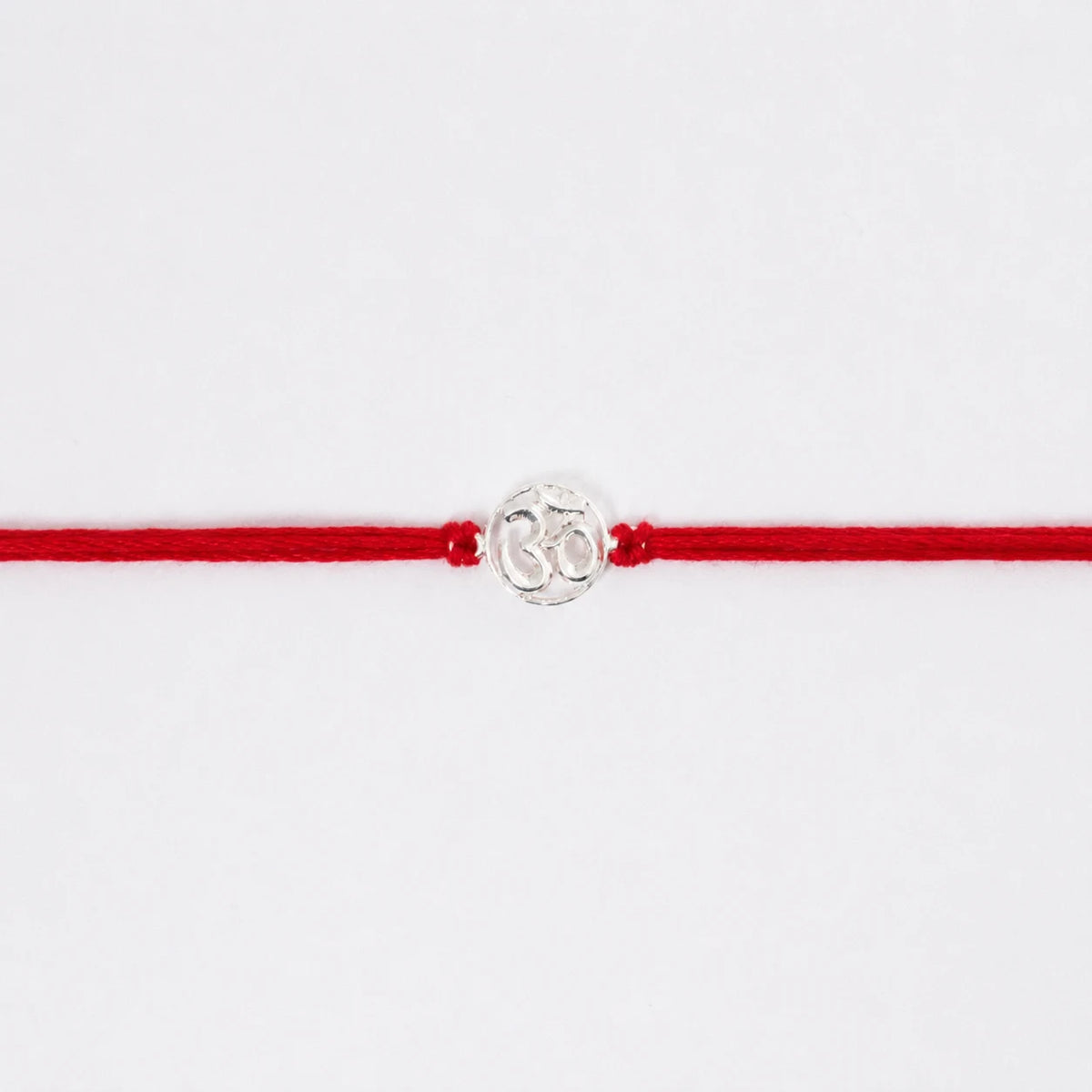 silver om rakhi
