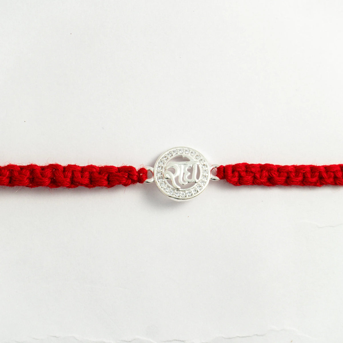 Silver Radha Rakhi for Brother with Handcrafted Red Thread