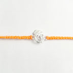 Silver Ganesha Om Rakhi for Brother with Handcrafted Orange Thread
