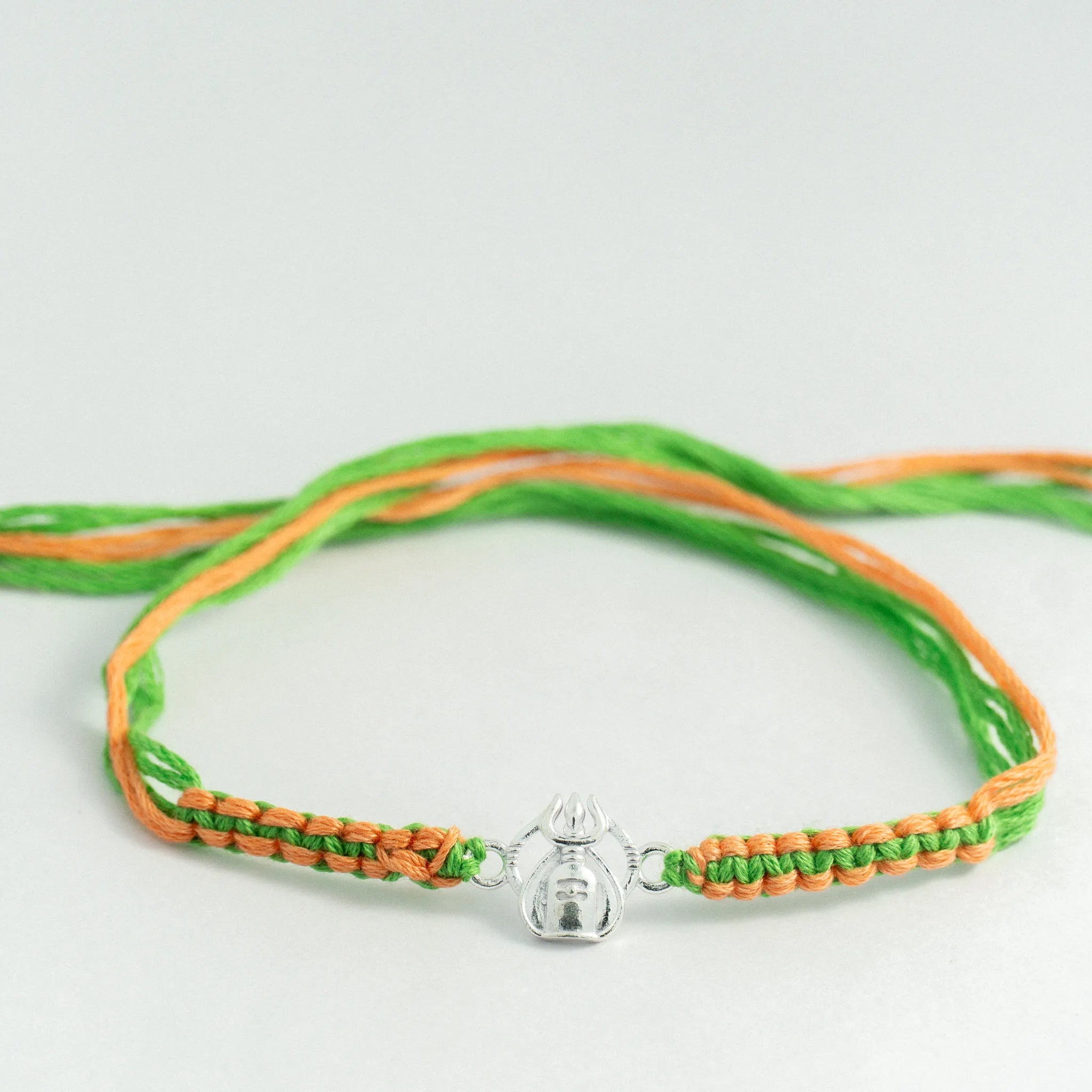 Silver Shivling Trishul Rakhi for Brother with Green and Saffron Thread