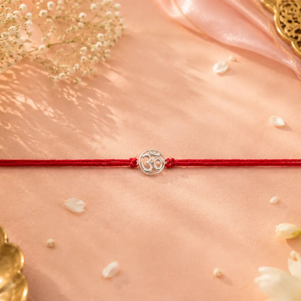 silver om rakhi